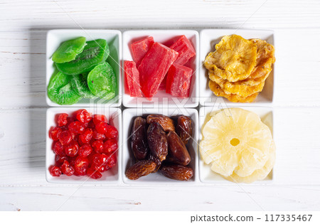 Group of dried and candied fruit in bowl Group of dried and candied fruit in bowl 117335467