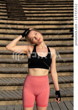 young sporty woman doing exercise young sporty woman doing exercise 117335512