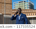 young businessman talking on the phone 117335524