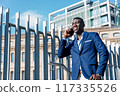 portrait of confident businessman outdoors low angle shot 117335526
