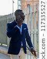 businessman talking on mobile phone 117335527