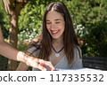 woman smiling at camera 117335532