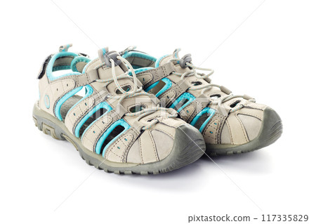 Close-Up of Beige and Blue Sport Sandals on White 117335829
