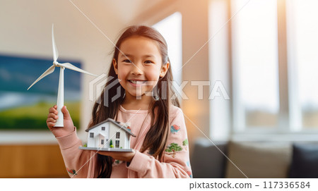 young cute girl with electric generator wind turbine toy and small house, sustainable energy 117336584