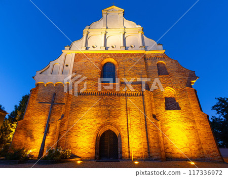 Church of St. Adalbert and the wooden bell tower in Poznan at sunset. Church of St. Adalbert and the wooden bell tower in Poznan at sunset. 117336972
