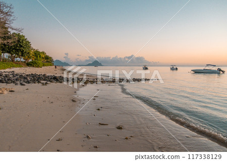Flic en Flac Beach on Mauritius island in the Indian Ocean during sunset 117338129