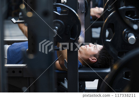 Sports gym, training gym, men, muscle training, bench press 117338211