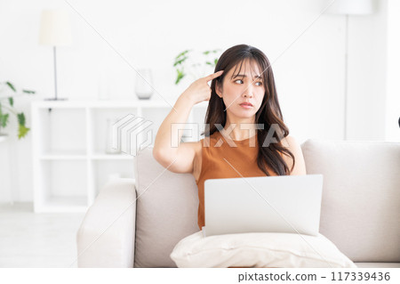 Young woman laptop computer trouble 117339436