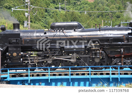 Steam locomotive C61 turning around on a turntable Steam locomotive C61 turning around on a turntable 117339768