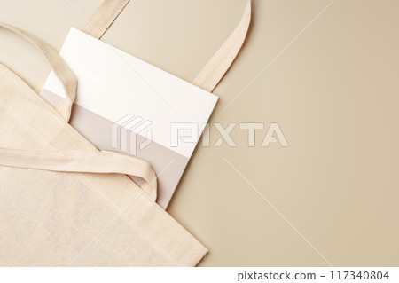 Stack of paper and fabric bag, blank objects for placing your design Stack of paper and fabric bag, blank objects for placing your design 117340804