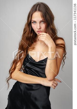 Woman in Black Dress Posing for Picture Woman in Black Dress Posing for Picture 117341136