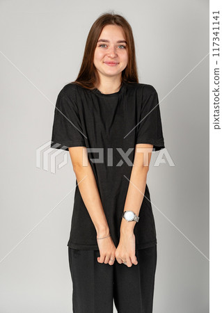 Young Woman in Black Shirt and Black Pants in Studio Young Woman in Black Shirt and Black Pants in Studio 117341141