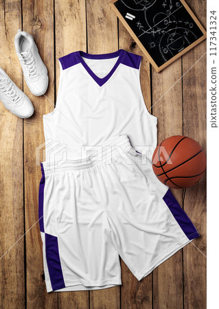 Basketball uniform on wooden background top view Basketball uniform on wooden background top view 117341324