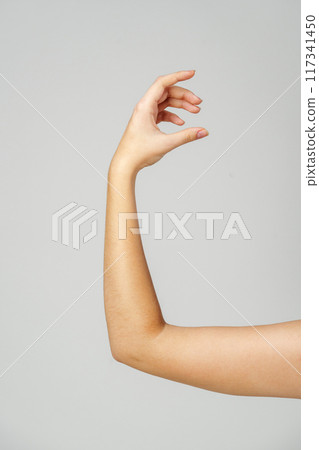 Young Woman Arm with Gesture close up Young Woman Arm with Gesture close up 117341450