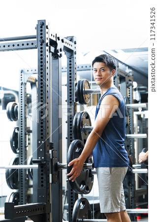 Sports gym, training gym, male, muscle training, portrait 117341526