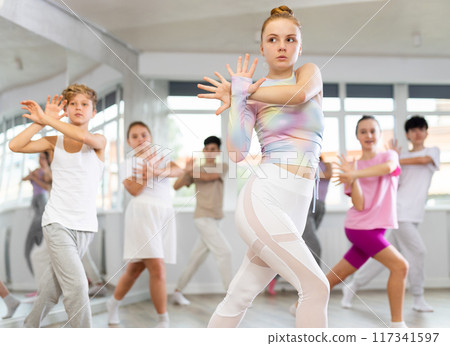 Group of children dancing jazz funk Group of children dancing jazz funk 117341597