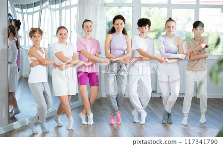 Teen dancers learn to dance Greek folk dance sirtaki and the Irish folk dance jig 117341790