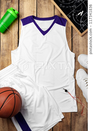 Basketball uniform on wooden background top view Basketball uniform on wooden background top view 117341836