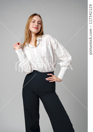 Young Woman in White Shirt Posing for Picture 117342129