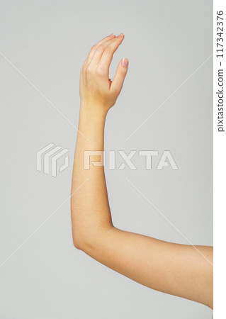 Young Woman Arm with Gesture close up Young Woman Arm with Gesture close up 117342376