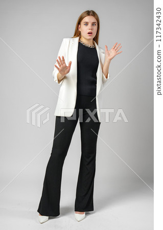 Excited Young Woman in Stylish Outfit Surprised Expression Excited Young Woman in Stylish Outfit Surprised Expression 117342430
