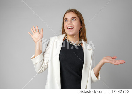 Excited Young Woman in Stylish Outfit Surprised Expression 117342500