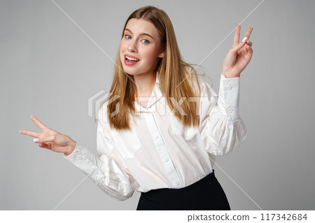 Woman Making Peace Sign With Fingers Woman Making Peace Sign With Fingers 117342684