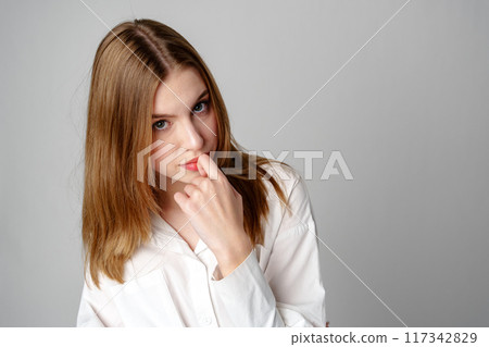 Concerned Young Woman deep in thought or contemplation 117342829