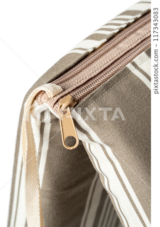 Close Up of Striped Zipper on Tan and White Tote Bag Close Up of Striped Zipper on Tan and White Tote Bag 117343083