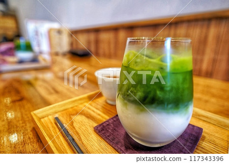 Delicious cold matcha latte Delicious cold matcha latte 117343396