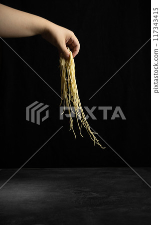 noodles in hand 117343415