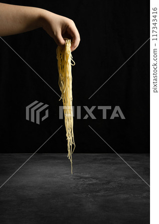 noodles in hand noodles in hand 117343416