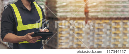 Banner Close up Hispanic men hands using pen touch smart tablet Warehouse management logistics counting checking products on inventory shelf. Man hands worker check stock control with copy space 117344537