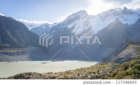 Alpine glacial landscape with huge mountains and lake on a sunny day, Mt Cook, New Zealand Alpine glacial landscape with huge mountains and lake on a sunny day, Mt Cook, New Zealand 117346043