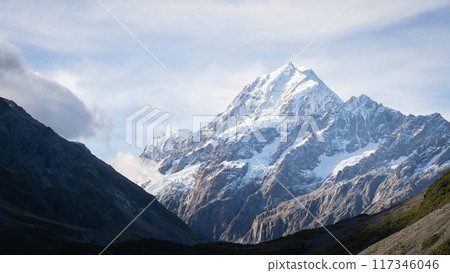 Detailed view on massive snowy mountain with glaciers from valley down below, Mt Cook, New Zealand 117346046