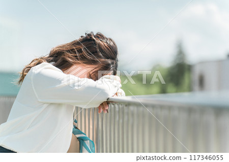Business woman crying on the rooftop (frustrated, defeated, depressed, stressed, slandered, bullied) 117346055