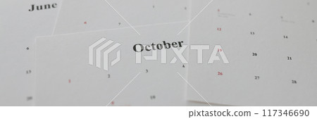 Calendar papers with marked dates lying on table Calendar papers with marked dates lying on table 117346690