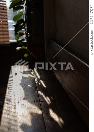 Empty tables of indoor  restaurant. blank wooden coffee table with blurred restaurant interior background. 117347074