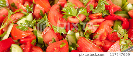 Salad consisting of tomatoes, cucumber, parsley and red pepper Salad consisting of tomatoes, cucumber, parsley and red pepper 117347699