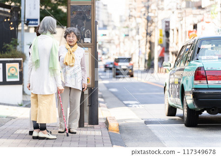 Senior woman waiting for the bus 117349678