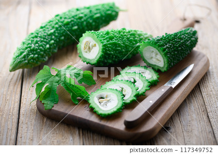 Image of cut summer vegetable bitter melon (bitter melon) 117349752