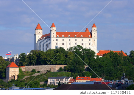 Bratislava, the capital of Slovakia in Central Europe. Bratislava Castle on a rocky hill overlooking the Danube River and the city. 117350451