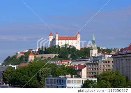Bratislava, the capital of Slovakia in Central Europe. Bratislava Castle on a rocky hill overlooking the Danube River and the city. 117350457