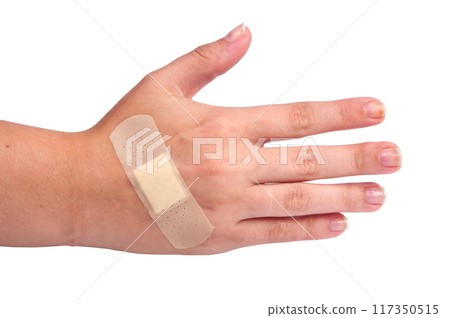 medical plaster or patch on hand isolated on the white medical plaster or patch on hand isolated on the white 117350515