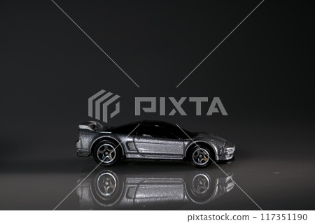 A simple yet captivating scene featuring a toy car, inviting all to relive their youthful explorations 117351190