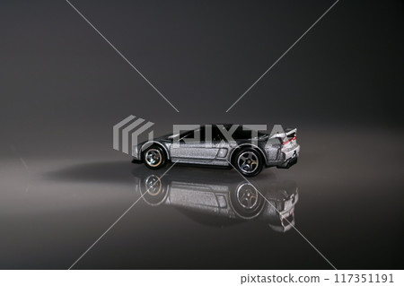 The stillness of the night surrounds this toy car, inviting memories of carefree days filled with exploration 117351191