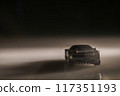 Even in the darkness, this toy car sparks imagination, reminding us of adventurous journeys yet to come. 117351193