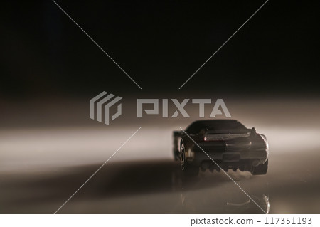 Even in the darkness, this toy car sparks imagination, reminding us of adventurous journeys yet to come. Even in the darkness, this toy car sparks imagination, reminding us of adventurous journeys yet to come. 117351193