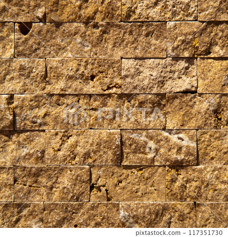 Cutting beige organic marble wall rectangular, seamless lined up 117351730