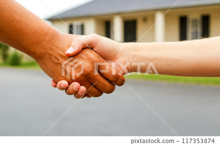 Handshake front house, real estate agreement success, property deal sealed handshake, homeownership transfer 117353874